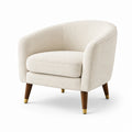 Poltrona in tessuto bouclé crema con gambe in legno